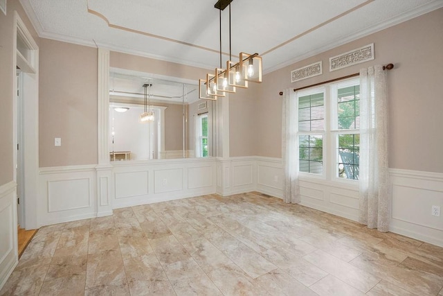 9008 N Hunter Ave, Kansas City, MO 64157 - unfurnished room with a decorative wall, ornamental molding, a wainscoted wall, and a chandelier