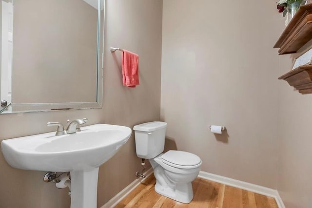 9008 N Hunter Ave, Kansas City, MO 64157 - bathroom featuring wood finished floors and toilet