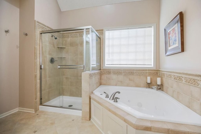 9008 N Hunter Ave, Kansas City, MO 64157 - bathroom featuring a shower stall, a jetted tub, and tile patterned floors