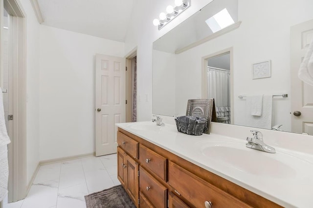 9008 N Hunter Ave, Kansas City, MO 64157 - full bath with double vanity and marble finish flooring