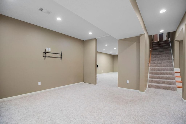 9008 N Hunter Ave, Kansas City, MO 64157 - finished below grade area with carpet floors, recessed lighting, and stairway