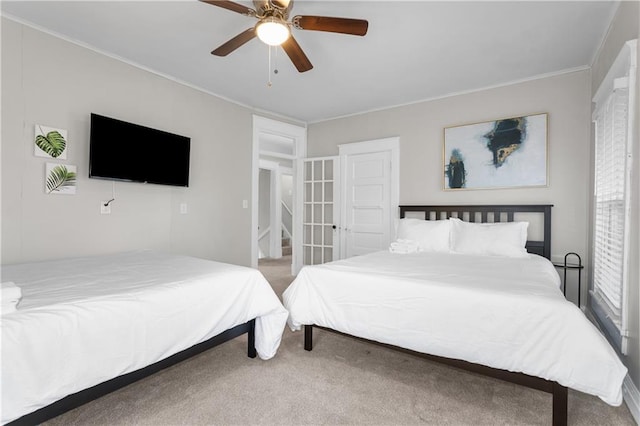 915 E 29th St, Kansas City, MO 64109 - bedroom with carpet flooring, crown molding, and a ceiling fan