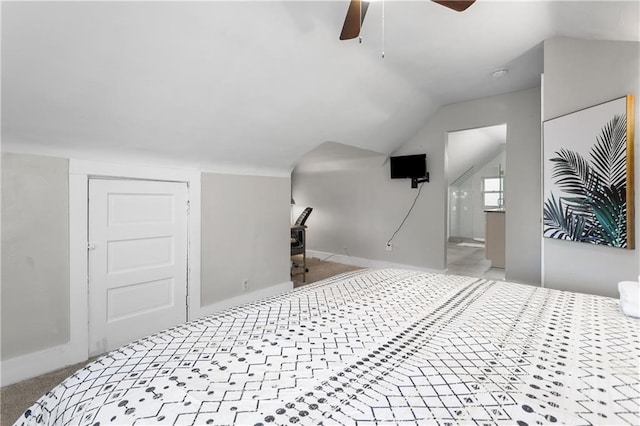 915 E 29th St, Kansas City, MO 64109 - unfurnished bedroom featuring lofted ceiling, carpet, baseboards, a ceiling fan, and ensuite bathroom
