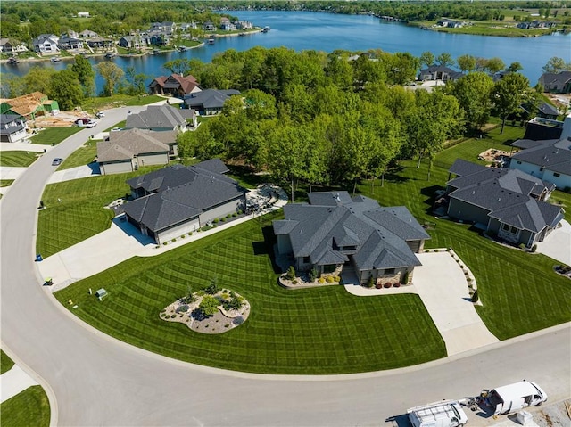 aerial overview of property's location featuring nearby suburban area and a nearby body of water