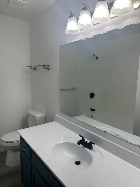 7037 N Holmes St, Gladstone, MO 64118 - full bathroom featuring toilet and vanity