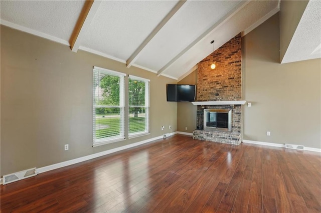 unfurnished living room featuring beamed ceiling, wood finished floors, a fireplace, high vaulted ceiling, and baseboards