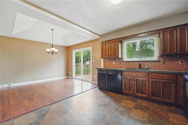 kitchen with dishwasher, a chandelier, tasteful backsplash, pendant lighting, and a textured ceiling