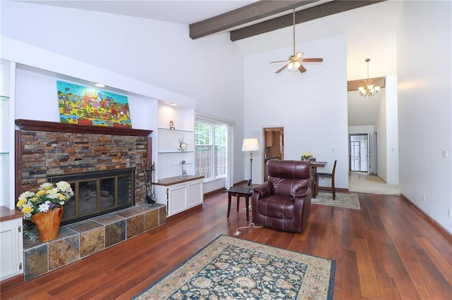2218 Condolea Ter, Leawood, KS 66209 - living area featuring a ceiling fan, beam ceiling, a fireplace, wood finished floors, and high vaulted ceiling