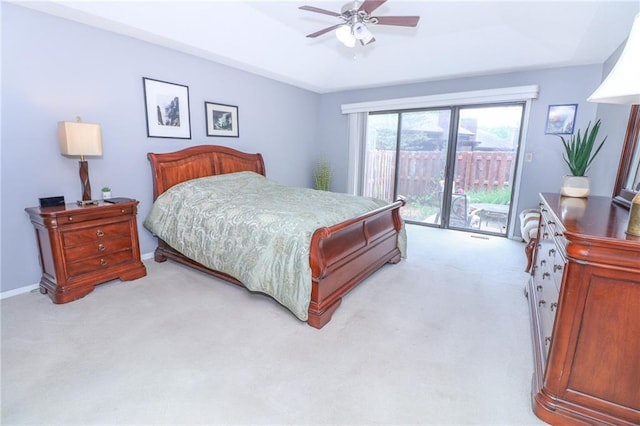 2218 Condolea Ter, Leawood, KS 66209 - bedroom featuring access to exterior, light colored carpet, a tray ceiling, ceiling fan, and baseboards