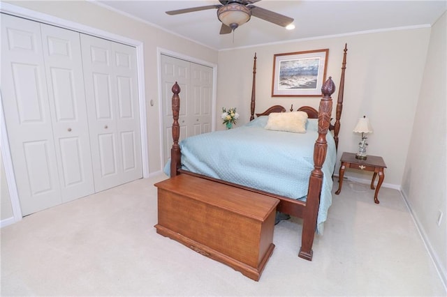 2218 Condolea Ter, Leawood, KS 66209 - carpeted bedroom with multiple closets, ornamental molding, baseboards, and a ceiling fan
