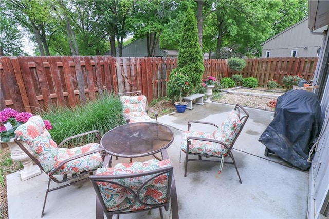 2218 Condolea Ter, Leawood, KS 66209 - view of patio featuring a fire pit and a fenced backyard