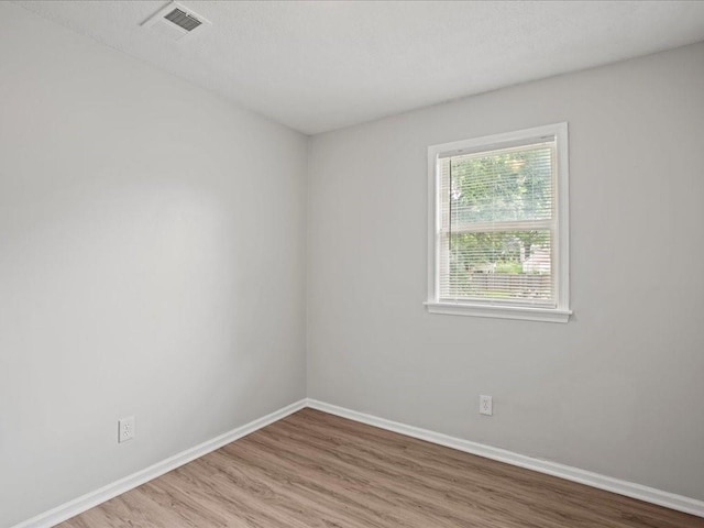 310-312 N 8th St, Leavenworth, KS 66048 - spare room featuring wood finished floors and baseboards