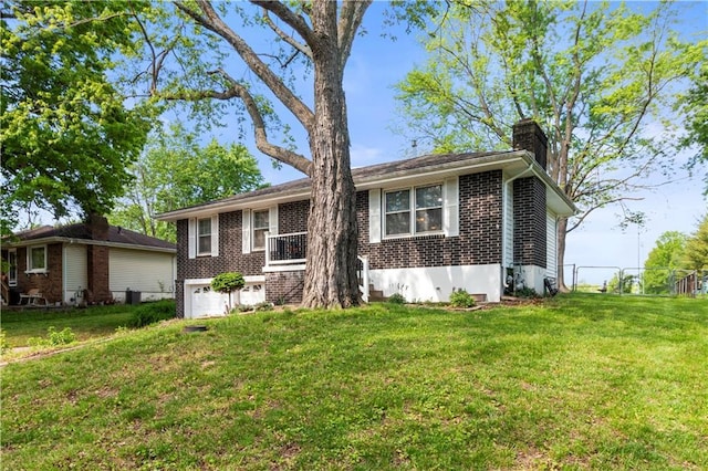 1608 SE Hillside Dr, Oak Grove, MO 64075 - single story home with a chimney, brick siding, and a garage