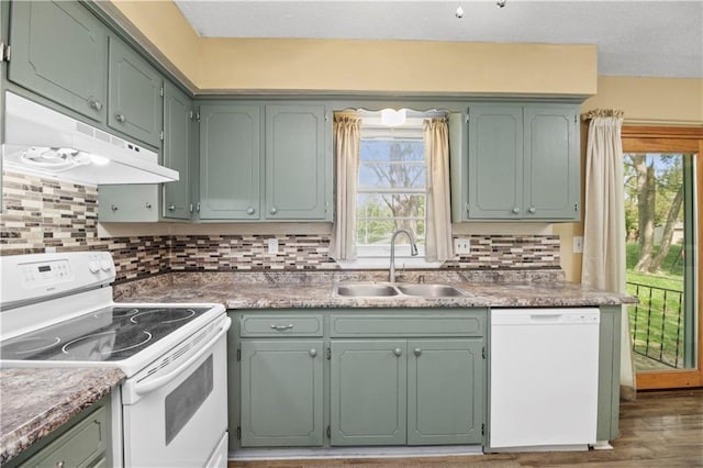 1608 SE Hillside Dr, Oak Grove, MO 64075 - kitchen featuring white appliances, under cabinet range hood, a sink, healthy amount of natural light, and a textured ceiling
