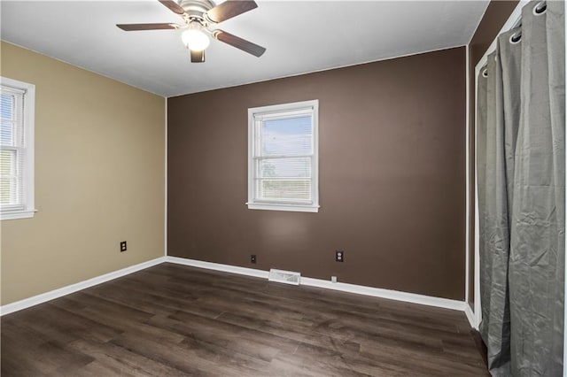 1608 SE Hillside Dr, Oak Grove, MO 64075 - unfurnished room with dark wood-style flooring, baseboards, and a ceiling fan
