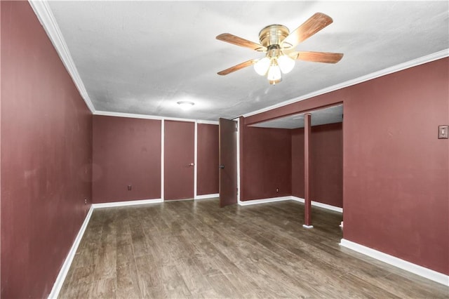 1608 SE Hillside Dr, Oak Grove, MO 64075 - spare room featuring wood finished floors, ceiling fan, baseboards, and crown molding