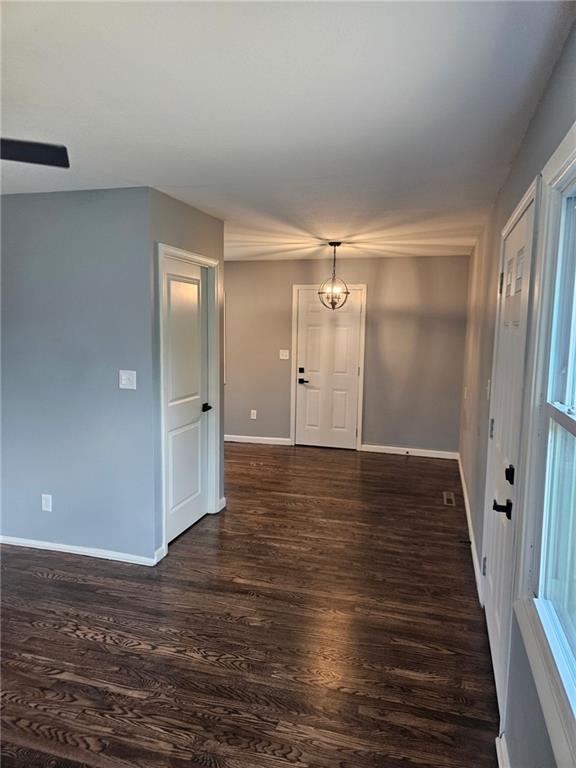 4715 E 45th St, Kansas City, MO 64130 - foyer featuring dark wood-type flooring and baseboards