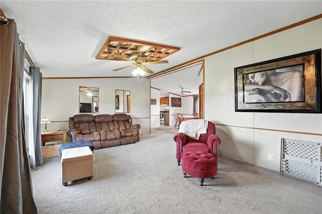39460 Indianapolis Rd, Lane, KS 66042 - living area with carpet, crown molding, ceiling fan, and a textured ceiling