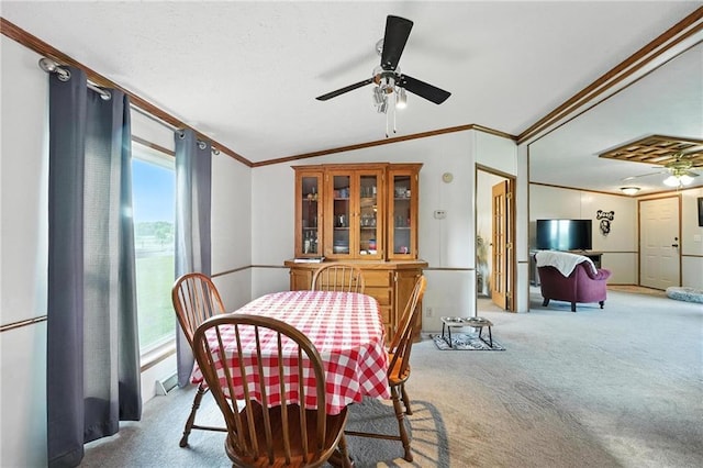 39460 Indianapolis Rd, Lane, KS 66042 - dining room featuring crown molding, carpet, a ceiling fan, and lofted ceiling