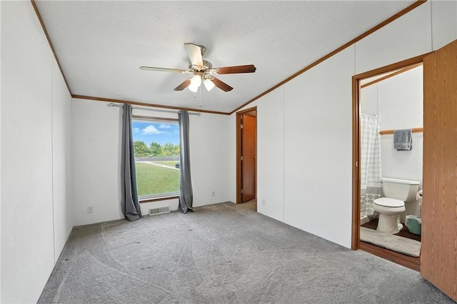 39460 Indianapolis Rd, Lane, KS 66042 - unfurnished bedroom with crown molding, carpet, ensuite bath, and ceiling fan