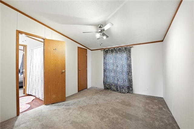 39460 Indianapolis Rd, Lane, KS 66042 - unfurnished bedroom featuring vaulted ceiling, carpet flooring, ornamental molding, and a ceiling fan