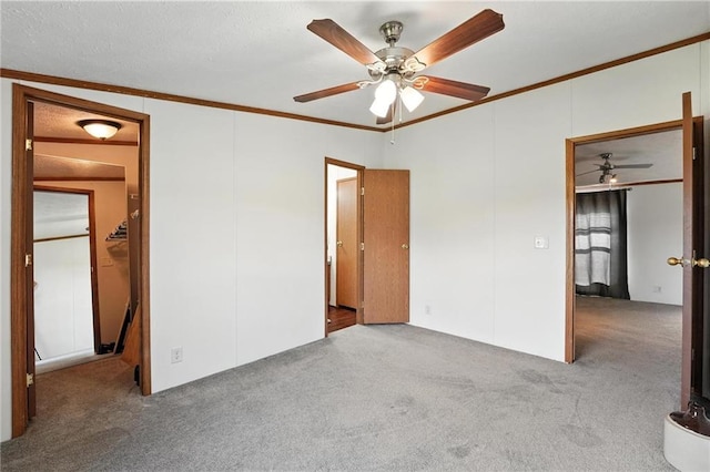 39460 Indianapolis Rd, Lane, KS 66042 - unfurnished bedroom featuring carpet, ornamental molding, and a ceiling fan