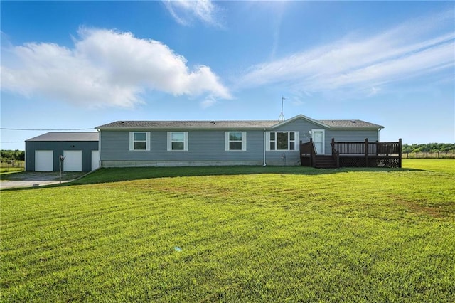 39460 Indianapolis Rd, Lane, KS 66042 - back of property featuring a deck, a garage, a lawn, and an outbuilding