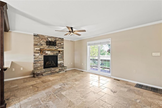 21815 W 73rd Ter, Shawnee, KS 66218 - unfurnished living room featuring stone tile flooring, a ceiling fan, crown molding, baseboards, and a stone fireplace