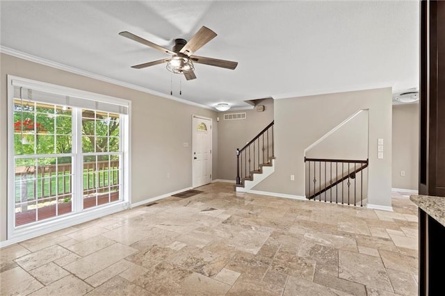 21815 W 73rd Ter, Shawnee, KS 66218 - entrance foyer with stone tile floors, ornamental molding, baseboards, a ceiling fan, and stairs