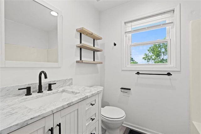 21815 W 73rd Ter, Shawnee, KS 66218 - bathroom featuring toilet, vanity, and baseboards