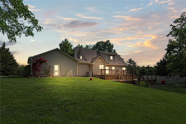 21815 W 73rd Ter, Shawnee, KS 66218 - back of property featuring a wooden deck, a yard, and central air condition unit