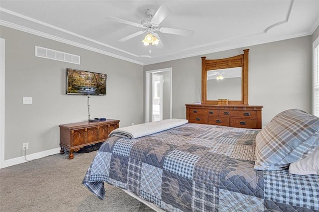 carpeted bedroom with ornamental molding, a ceiling fan, and baseboards