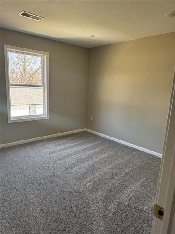 305 N Prairie St, Hamilton, MO 64644 - carpeted spare room with baseboards and a textured ceiling
