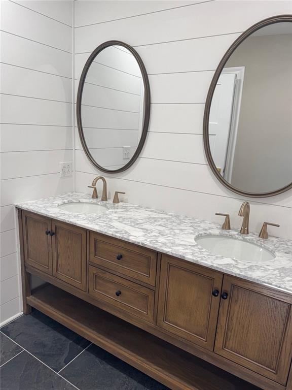305 N Prairie St, Hamilton, MO 64644 - bathroom with double vanity and tile patterned floors