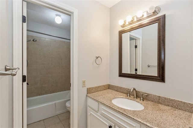bathroom featuring tile patterned flooring, toilet, vanity, and shower / bath combination