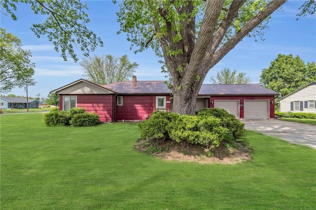 single story home with a front yard, concrete driveway, a garage, and a chimney