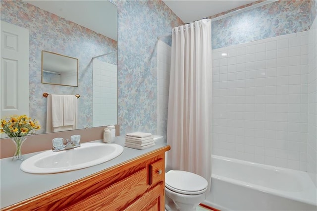 bathroom featuring wallpapered walls, toilet, shower / bath combo, and vanity