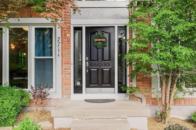 7711 N Montgall Ave, Kansas City, MO 64119 - view of exterior entry featuring brick siding