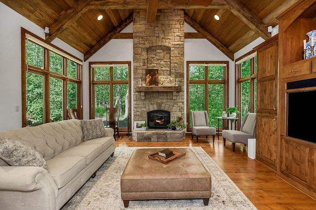 7711 N Montgall Ave, Kansas City, MO 64119 - living area featuring wooden ceiling, wood finished floors, and a fireplace