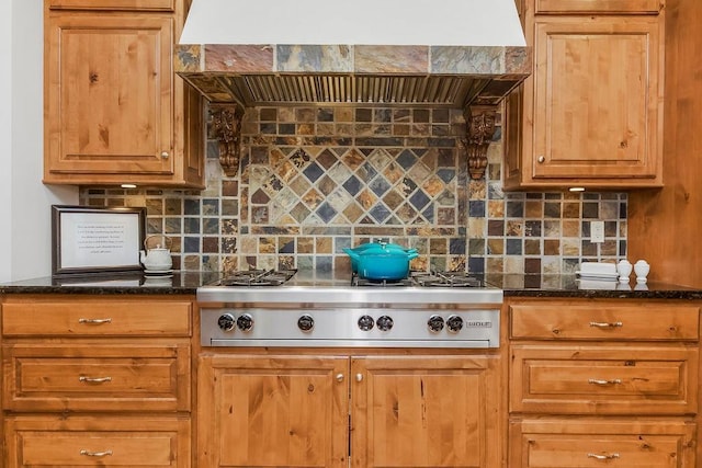 7711 N Montgall Ave, Kansas City, MO 64119 - kitchen featuring custom exhaust hood, stainless steel gas stovetop, tasteful backsplash, and dark stone countertops