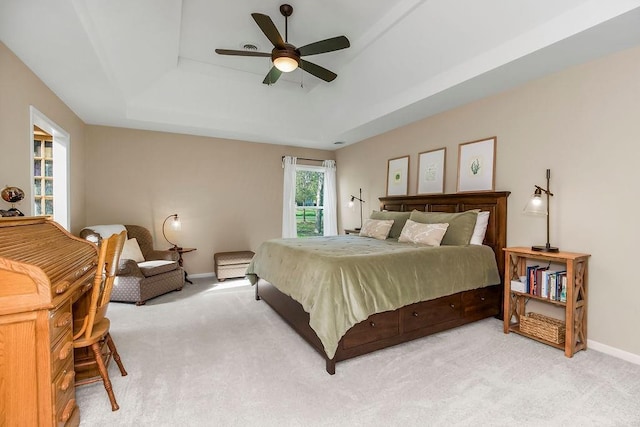 7711 N Montgall Ave, Kansas City, MO 64119 - bedroom featuring a raised ceiling, light carpet, baseboards, and a ceiling fan