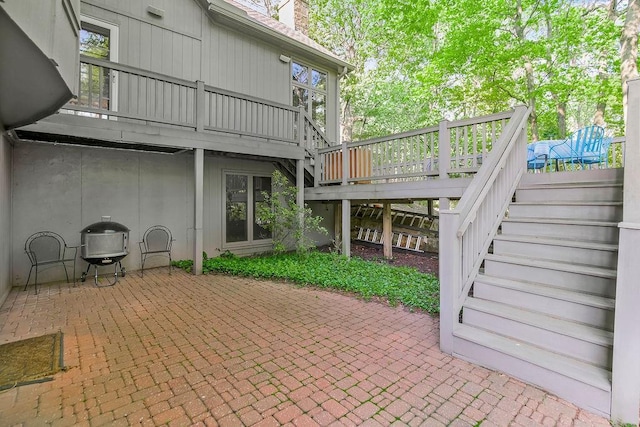 7711 N Montgall Ave, Kansas City, MO 64119 - view of patio / terrace with stairway and a wooden deck