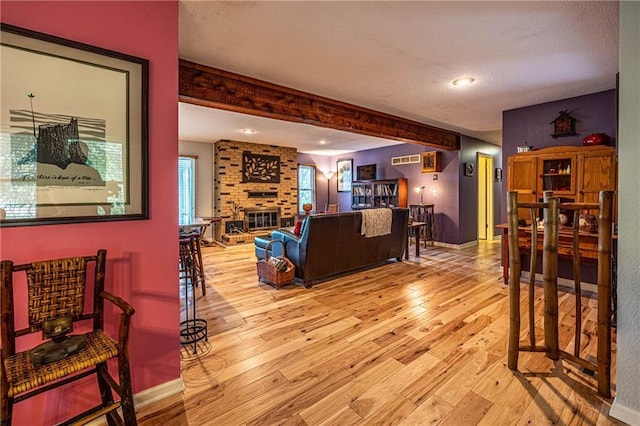 537 NE State Route 13th Hwy, Warrensburg, MO 64093 - living area featuring hardwood / wood-style flooring, a fireplace, beam ceiling, baseboards, and recessed lighting