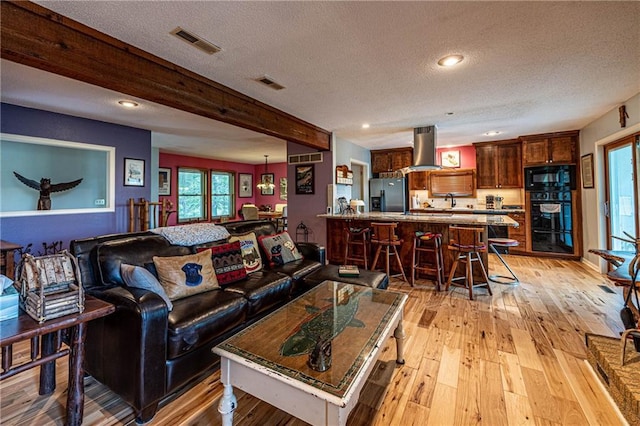 537 NE State Route 13th Hwy, Warrensburg, MO 64093 - living area with a textured ceiling, light wood finished floors, and recessed lighting