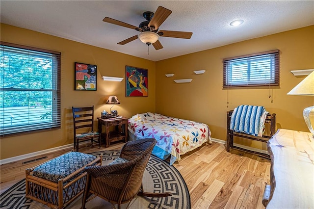 537 NE State Route 13th Hwy, Warrensburg, MO 64093 - bedroom with wood finished floors, baseboards, and a ceiling fan