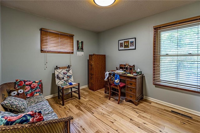 537 NE State Route 13th Hwy, Warrensburg, MO 64093 - office space with light wood finished floors, a textured ceiling, and baseboards