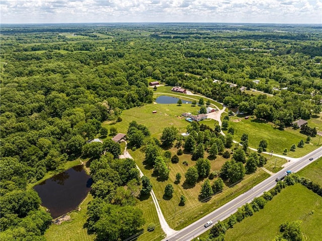 537 NE State Route 13th Hwy, Warrensburg, MO 64093 - drone / aerial view of a nearby body of water and a heavily wooded area