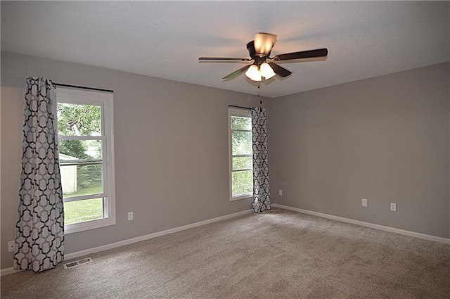 1748 NE Ridgeview Dr, Lees Summit, MO 64086 - empty room featuring ceiling fan, carpet, and baseboards