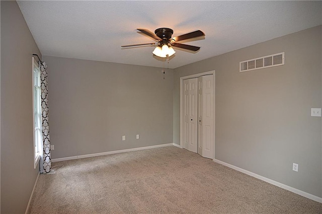 1748 NE Ridgeview Dr, Lees Summit, MO 64086 - unfurnished room featuring ceiling fan, carpet, and baseboards