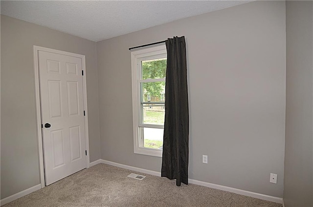1748 NE Ridgeview Dr, Lees Summit, MO 64086 - carpeted empty room featuring baseboards and a textured ceiling